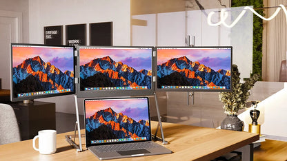 Multiple computer monitors displaying mountain landscapes on a desk with a laptop.